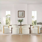 Silla de comedor tapizada Spruce&Spring con reposabrazos de madera y ruedas ocultas