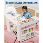 Mesa de arte para niños, escritorio de manualidades grande para niños con 2 sillas, escritorio de arte multifuncional con estantes de almacenamiento para habitación infantil, guardería, sala de juegos, escuela