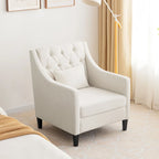 Sillón decorativo tapizado en beige con botones y cojín lumbar
