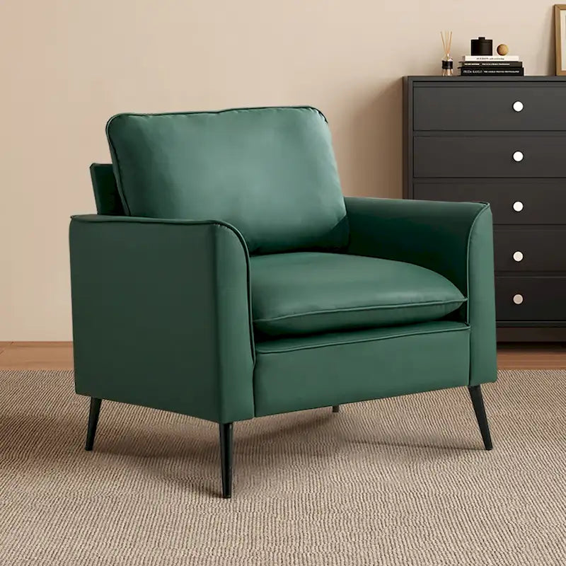 Sillón decorativo tapizado en verde con cojines y almohadas