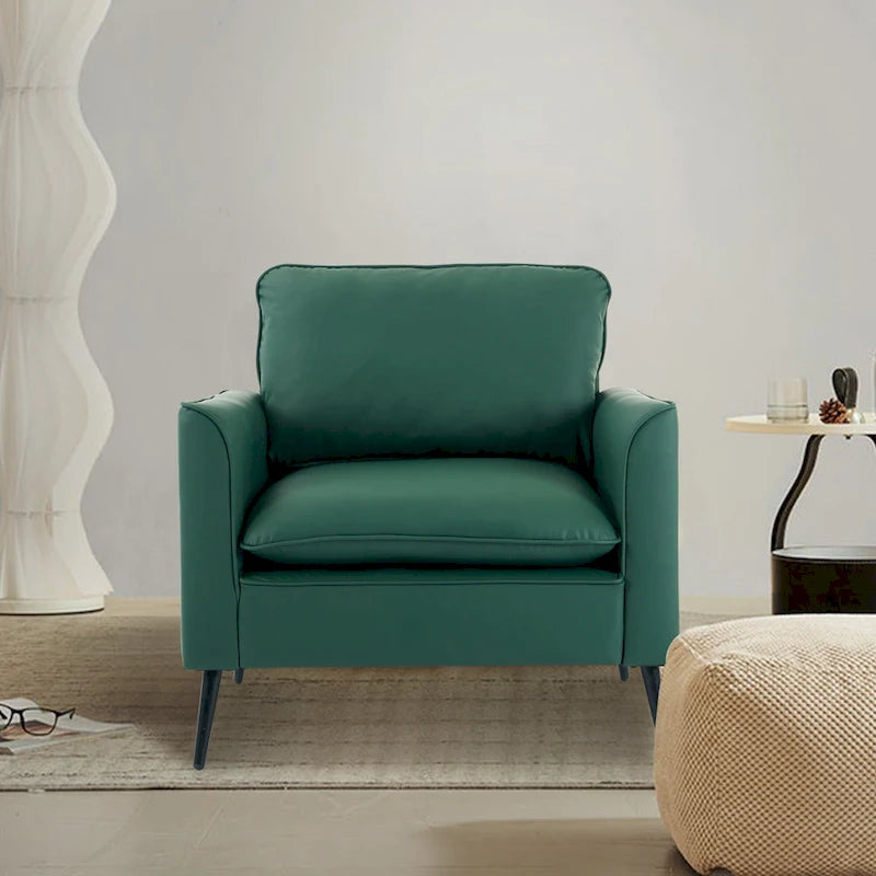 Sillón decorativo tapizado en verde con cojines y almohadas