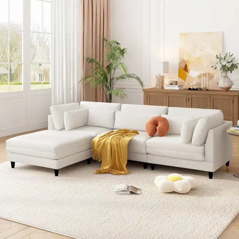 Sofá modular seccional con otomana y almohadas