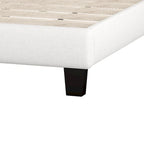 Base de cama tapizada con plataforma, cabecero curvo tipo silla de montar y detalles de rombos capitoné