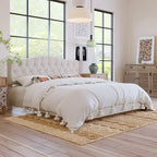 Base de cama tapizada con plataforma, cabecero curvo tipo silla de montar y detalles de rombos capitoné