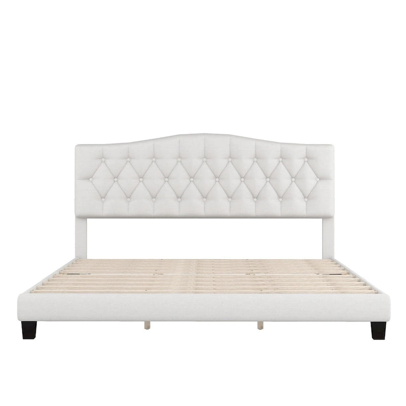 Base de cama tapizada con plataforma, cabecero curvo tipo silla de montar y detalles de rombos capitoné