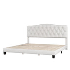 Base de cama tapizada con plataforma, cabecero curvo tipo silla de montar y detalles de rombos capitoné