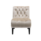 Sillón decorativo de terciopelo beige con capitoné y patas de madera